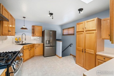 Located on a quiet street in the heart of Loveland, this home on The Olde Course At Loveland in Colorado - for sale on GolfHomes.com, golf home, golf lot