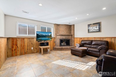 Located on a quiet street in the heart of Loveland, this home on The Olde Course At Loveland in Colorado - for sale on GolfHomes.com, golf home, golf lot