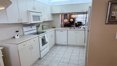 This condo is located in the prestigious *The Island* section of on  in Florida - for sale on GolfHomes.com, golf home, golf lot