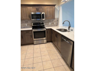 Discover this stunning 3-bedroom, 3-bath townhouse with a 2-car on Woodlake Country Club in North Carolina - for sale on GolfHomes.com, golf home, golf lot