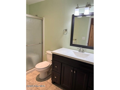 Discover this stunning 3-bedroom, 3-bath townhouse with a 2-car on Woodlake Country Club in North Carolina - for sale on GolfHomes.com, golf home, golf lot