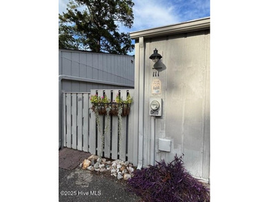 Discover this stunning 3-bedroom, 3-bath townhouse with a 2-car on Woodlake Country Club in North Carolina - for sale on GolfHomes.com, golf home, golf lot