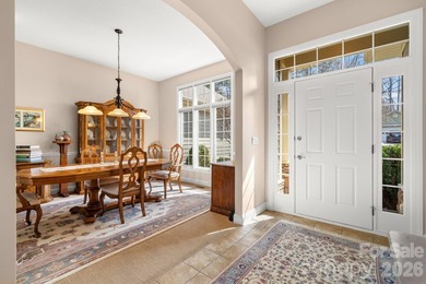 Perched on a gentle hill with sweeping views of the 7th and 9th on Cummings Cove Golf and Country Club in North Carolina - for sale on GolfHomes.com, golf home, golf lot