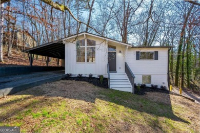 This mid-century modern bungalow in the *city* of Mountain Park on Brookfield Country Club in Georgia - for sale on GolfHomes.com, golf home, golf lot