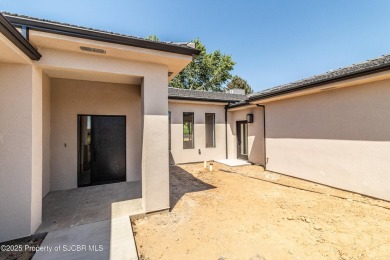 Experience refined living in this stunning 4-bedroom, 3-bath on San Juan Country Club in New Mexico - for sale on GolfHomes.com, golf home, golf lot