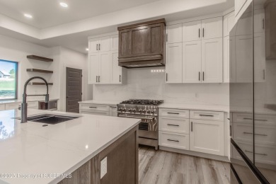 Experience refined living in this stunning 4-bedroom, 3-bath on San Juan Country Club in New Mexico - for sale on GolfHomes.com, golf home, golf lot