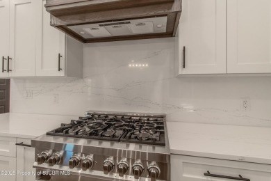 Experience refined living in this stunning 4-bedroom, 3-bath on San Juan Country Club in New Mexico - for sale on GolfHomes.com, golf home, golf lot