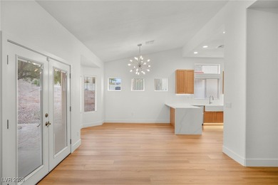 This beautifully updated Sun City Summerlin home has an open on Highland Falls Golf Club in Nevada - for sale on GolfHomes.com, golf home, golf lot