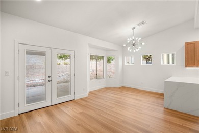 This beautifully updated Sun City Summerlin home has an open on Highland Falls Golf Club in Nevada - for sale on GolfHomes.com, golf home, golf lot