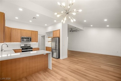 This beautifully updated Sun City Summerlin home has an open on Highland Falls Golf Club in Nevada - for sale on GolfHomes.com, golf home, golf lot