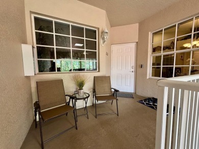 Lovely unfurnished second-floor unit at Flamingo Fairways in on Lely Resort Golf and Country Club in Florida - for sale on GolfHomes.com, golf home, golf lot