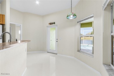 This stunning 4-bedroom, 2.5-bath waterfront pool home is on Burnt Store Golf Club in Florida - for sale on GolfHomes.com, golf home, golf lot