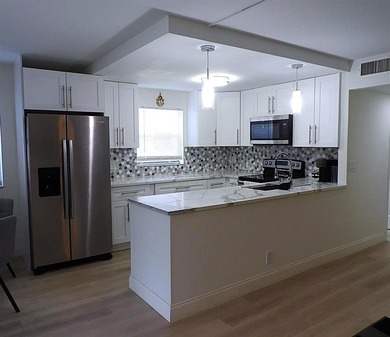 Welcome to this beautifully updated 2-bedroom & 2-bath first on Kings Point Golf -Flanders Way in Florida - for sale on GolfHomes.com, golf home, golf lot