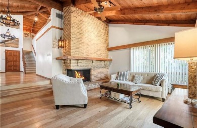 Soaring cedar ceilings, an abundance of natural light, and on The Dunedin Country Club in Florida - for sale on GolfHomes.com, golf home, golf lot