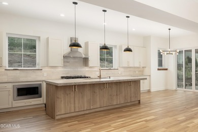 This Mountain Chic home is all about the views ! With windows on Headwaters Golf Course At Granby Ranch in Colorado - for sale on GolfHomes.com, golf home, golf lot