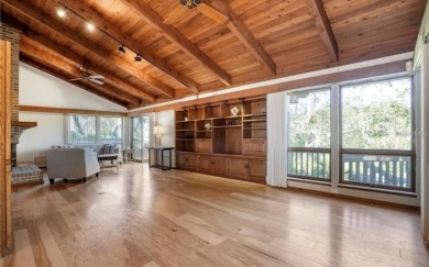 Soaring cedar ceilings, an abundance of natural light, and on The Dunedin Country Club in Florida - for sale on GolfHomes.com, golf home, golf lot