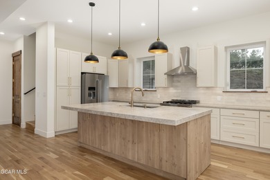 This Mountain Chic home is all about the views ! With windows on Headwaters Golf Course At Granby Ranch in Colorado - for sale on GolfHomes.com, golf home, golf lot