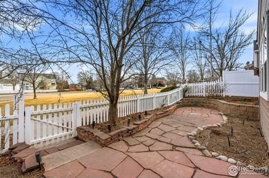 This charming end-unit townhome is nestled in the highly on Indian Peaks Golf Course in Colorado - for sale on GolfHomes.com, golf home, golf lot