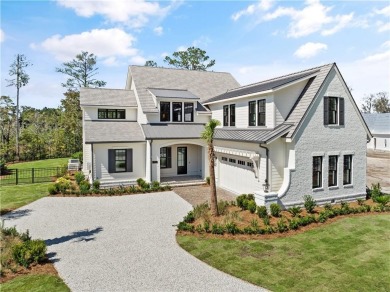 21 Fred Drive is a modern Tudor cottage designed for island on Frederica Golf Club in Georgia - for sale on GolfHomes.com, golf home, golf lot