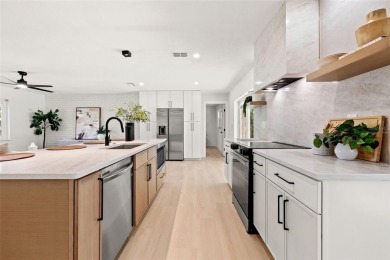 Beautifully renovated, this 3 bed, 2 bath home has over 1,600 on Countryside Country Club in Florida - for sale on GolfHomes.com, golf home, golf lot