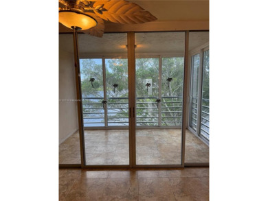 2/2 well-kept unit w/ screened-in patio & water view. Marble on Pine Island Ridge Country Club in Florida - for sale on GolfHomes.com, golf home, golf lot