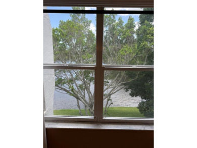 2/2 well-kept unit w/ screened-in patio & water view. Marble on Pine Island Ridge Country Club in Florida - for sale on GolfHomes.com, golf home, golf lot