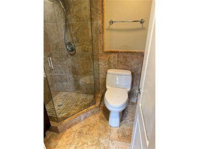 2/2 well-kept unit w/ screened-in patio & water view. Marble on Pine Island Ridge Country Club in Florida - for sale on GolfHomes.com, golf home, golf lot
