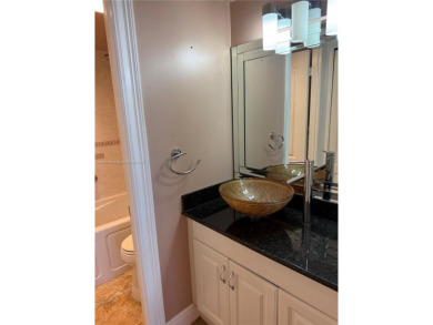 2/2 well-kept unit w/ screened-in patio & water view. Marble on Pine Island Ridge Country Club in Florida - for sale on GolfHomes.com, golf home, golf lot