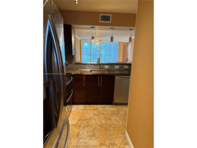 2/2 well-kept unit w/ screened-in patio & water view. Marble on Pine Island Ridge Country Club in Florida - for sale on GolfHomes.com, golf home, golf lot