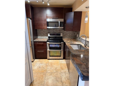 2/2 well-kept unit w/ screened-in patio & water view. Marble on Pine Island Ridge Country Club in Florida - for sale on GolfHomes.com, golf home, golf lot