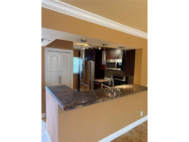 2/2 well-kept unit w/ screened-in patio & water view. Marble on Pine Island Ridge Country Club in Florida - for sale on GolfHomes.com, golf home, golf lot