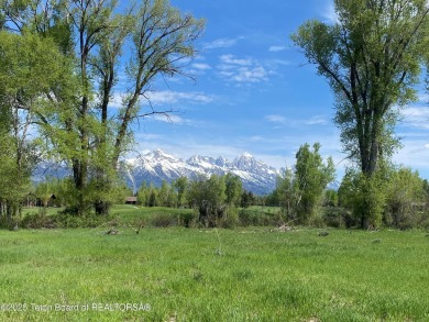 Enjoy beautiful Grand Teton views from this premier .84 acre lot on Jackson Hole Golf and Tennis Club in Wyoming - for sale on GolfHomes.com, golf home, golf lot