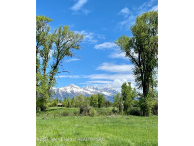 Enjoy beautiful Grand Teton views from this premier .84 acre lot on Jackson Hole Golf and Tennis Club in Wyoming - for sale on GolfHomes.com, golf home, golf lot