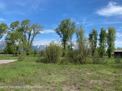 Enjoy beautiful Grand Teton views from this premier .84 acre lot on Jackson Hole Golf and Tennis Club in Wyoming - for sale on GolfHomes.com, golf home, golf lot