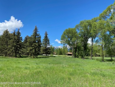 Enjoy beautiful Grand Teton views from this premier .84 acre lot on Jackson Hole Golf and Tennis Club in Wyoming - for sale on GolfHomes.com, golf home, golf lot