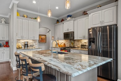 Custom-built beauty overlooking the 11th green of Granada Golf on Granada Golf Course in Arkansas - for sale on GolfHomes.com, golf home, golf lot