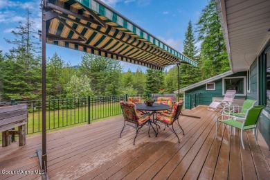 This impeccably maintained Priest Lake home perfectly blends on Priest Lake Golf and Tennis Club in Idaho - for sale on GolfHomes.com, golf home, golf lot