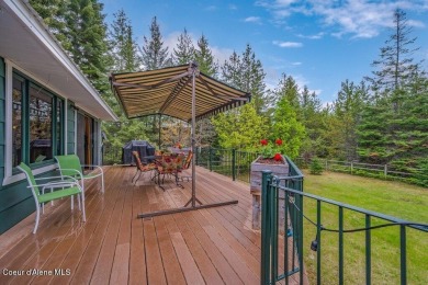 This impeccably maintained Priest Lake home perfectly blends on Priest Lake Golf and Tennis Club in Idaho - for sale on GolfHomes.com, golf home, golf lot