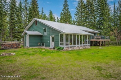 This impeccably maintained Priest Lake home perfectly blends on Priest Lake Golf and Tennis Club in Idaho - for sale on GolfHomes.com, golf home, golf lot