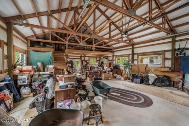 This impeccably maintained Priest Lake home perfectly blends on Priest Lake Golf and Tennis Club in Idaho - for sale on GolfHomes.com, golf home, golf lot