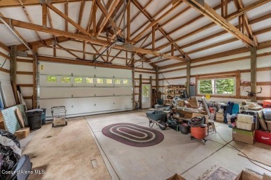 This impeccably maintained Priest Lake home perfectly blends on Priest Lake Golf and Tennis Club in Idaho - for sale on GolfHomes.com, golf home, golf lot