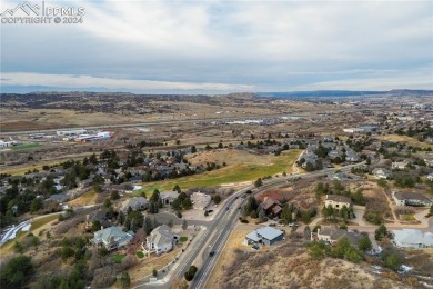 Set on a spacious lot with plenty of room between neighbors on Plum Creek Golf and Country Club in Colorado - for sale on GolfHomes.com, golf home, golf lot