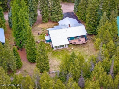 This impeccably maintained Priest Lake home perfectly blends on Priest Lake Golf and Tennis Club in Idaho - for sale on GolfHomes.com, golf home, golf lot