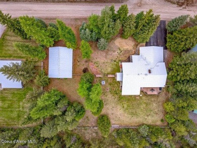 This impeccably maintained Priest Lake home perfectly blends on Priest Lake Golf and Tennis Club in Idaho - for sale on GolfHomes.com, golf home, golf lot