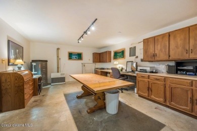 This impeccably maintained Priest Lake home perfectly blends on Priest Lake Golf and Tennis Club in Idaho - for sale on GolfHomes.com, golf home, golf lot