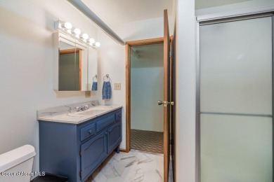 This impeccably maintained Priest Lake home perfectly blends on Priest Lake Golf and Tennis Club in Idaho - for sale on GolfHomes.com, golf home, golf lot