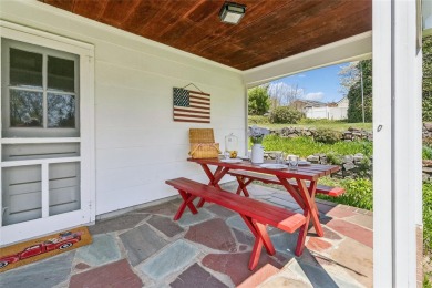 Welcome to 1440 Roanoke Ave, a charming cape-style home nestled on Sandy Pond Golf Course in New York - for sale on GolfHomes.com, golf home, golf lot