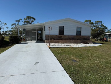 This lovely, manufactured home on leased land is located in Lake on Pine Lakes Country Club in Florida - for sale on GolfHomes.com, golf home, golf lot