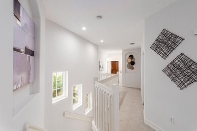 GORGEOUS corner unit - light, bright, and elevated for panoramic on Hammock Bay in Florida - for sale on GolfHomes.com, golf home, golf lot