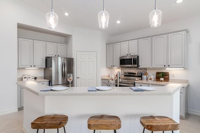 GORGEOUS corner unit - light, bright, and elevated for panoramic on Hammock Bay in Florida - for sale on GolfHomes.com, golf home, golf lot